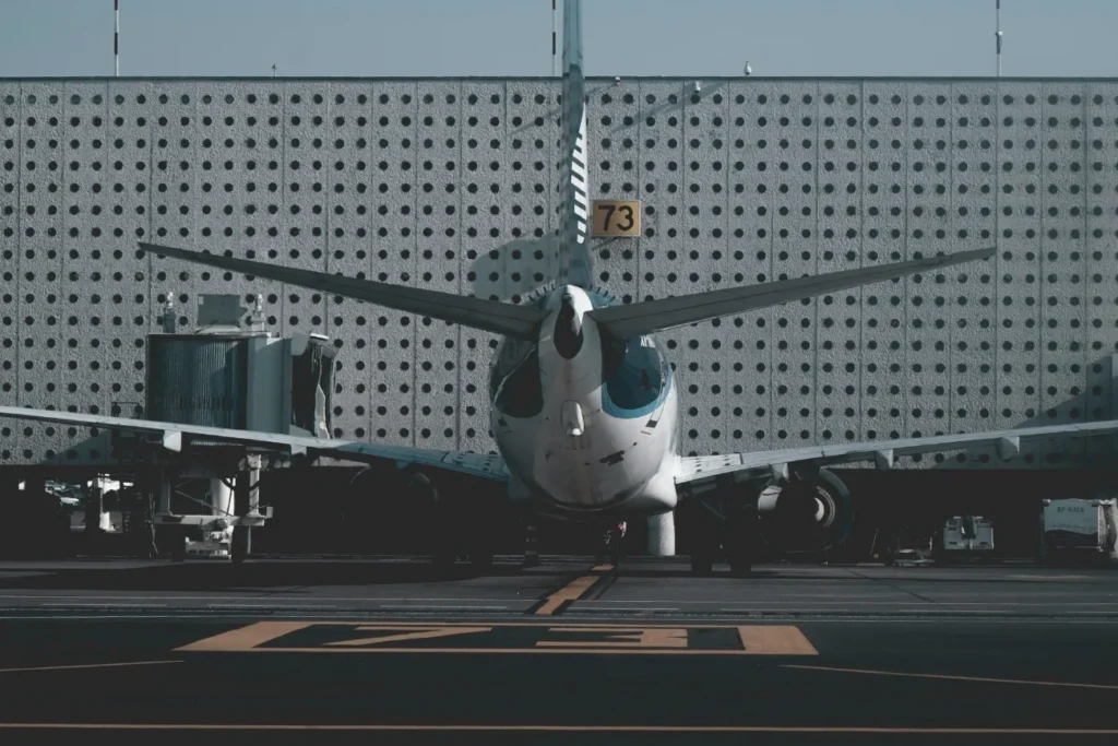 Book flights with deposit only UK – commercial aircraft at airport gate ready for departure