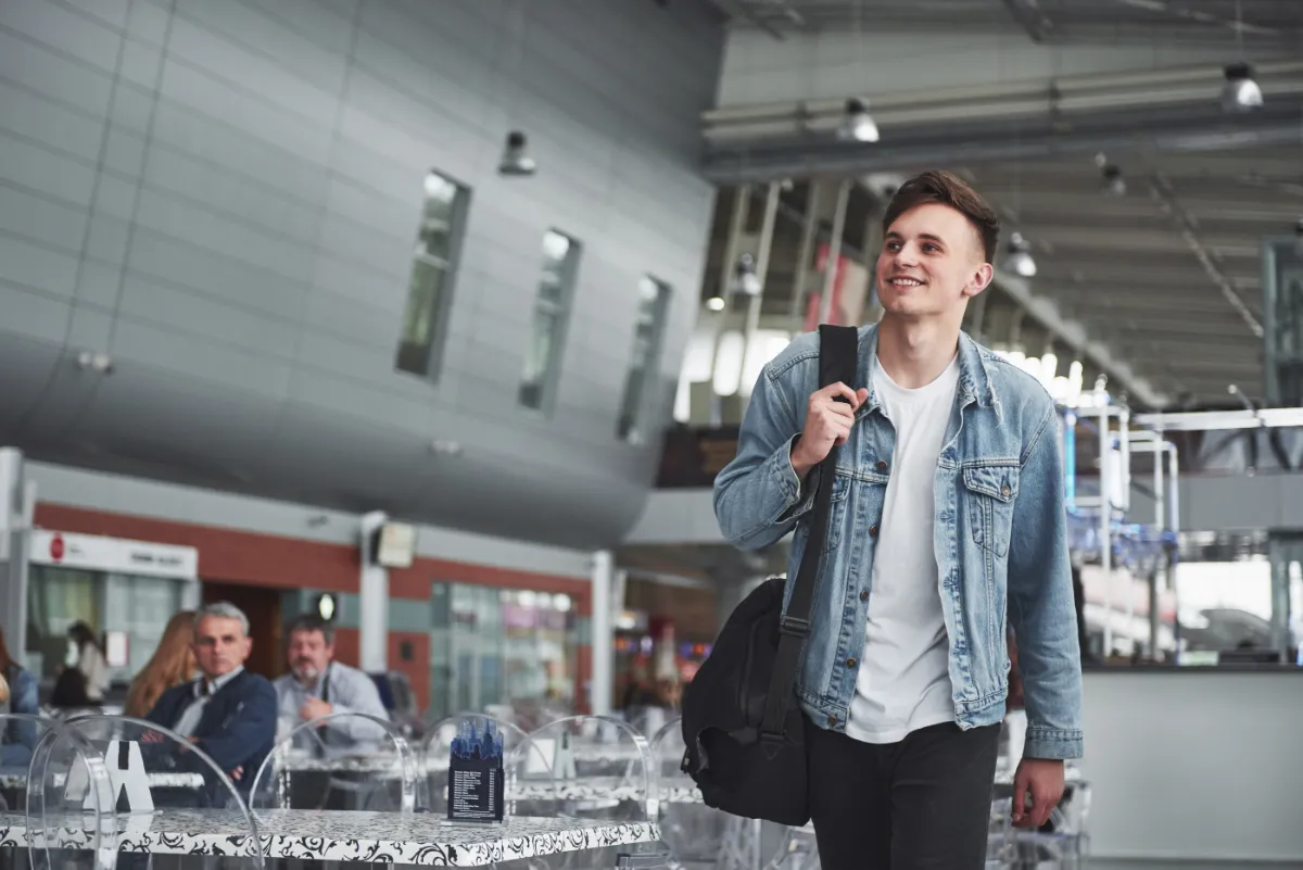 Student at airport booking flights book now pay later no credit check UK – Skylines Trips